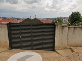 Land for sale; two houses and on tarmac road!