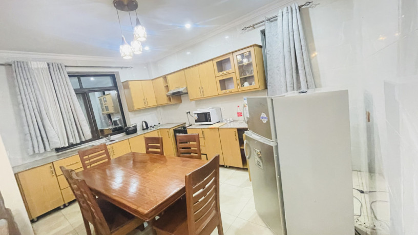 remera-near-amahoro-stadium-2bedrooms-fully-furnished-apartment-for-rent-at-700k480usd-on-tarmac-road-big-4